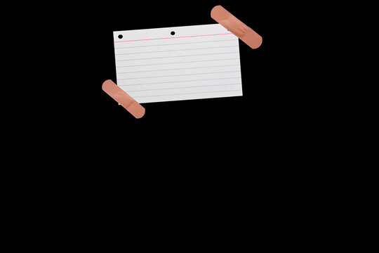 Piece of notebook paper patched with a torn bandage, isolated black JPEG.