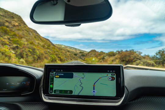 Navigating road trip route in car on el hierro island