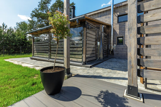 Modern Country House Exterior with Covered Terrace and Decking