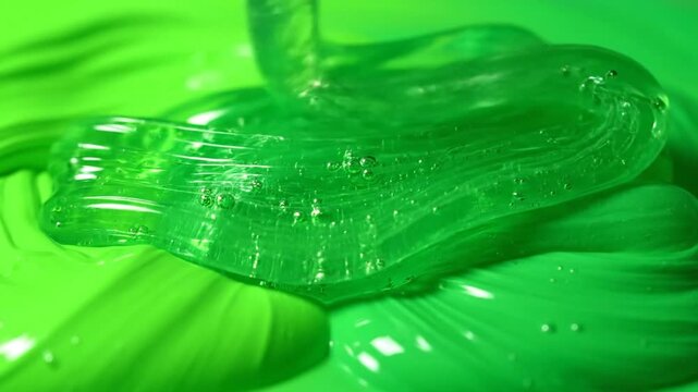 Closeup of Transparent Gel on Green Surface.