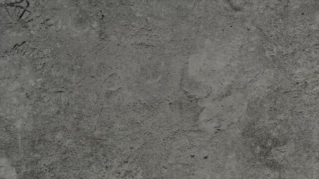 A high resolution close up of a grey concrete wall surface.