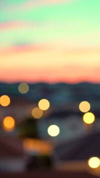 A Serene Evening Landscape with Bokeh Effects, Featuring Blurred Homes and a Soft Pastel Sunset that Evokes a Peaceful Atmosphere of Natural Beauty