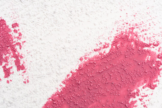 White powder on pink background for makeup advertising design