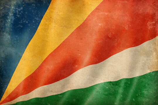 Old vintage flag of Seychelles, worn and stained
