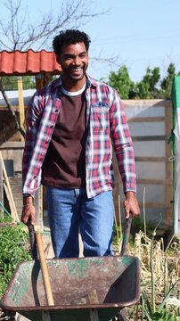 African american family working together in community garden