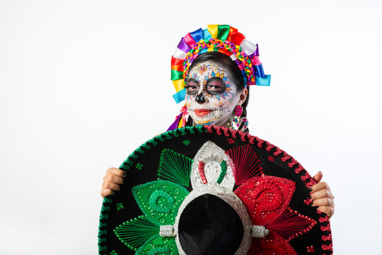Woman with Day of the Dead Makeup Presenting Traditional Mexican Charro Sombrero