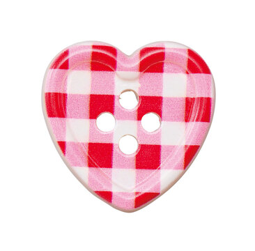 Heart shaped pink and red gingham check sewing button isolated on white background