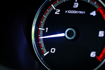 Fototapeta premium Close-up of a diesel truck's dashboard and tachometer. It represents the power and durability of a work vehicle, with a clear focus on the round engine meters.