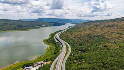 Naklejka premium Drone shot The M6 motorway Nakhon Ratchasima Province - Bang Pa-in Lam Ta Khong River and Mountain. Motorway Korat Thailand