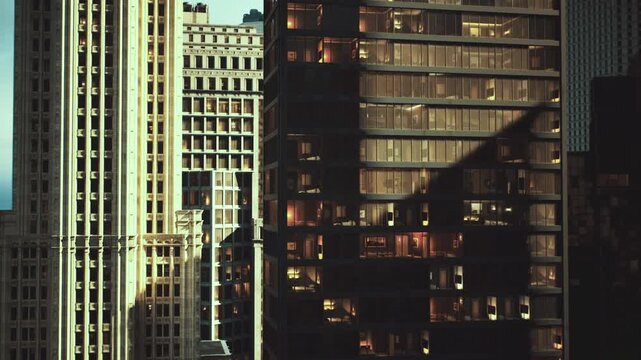 Strong shadows cutting across Seattle skyscrapers, sharp contrast and dramatic geometry create cinematic mood, layered facades and glowing windows add depth