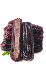 Sweet Black Sticky Corn Cobs with Dark Purple Kernels and Fresh Mint Leaf on White Background © BuiThi