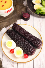 Black Sticky Corn with Boiled Eggs and Cherry Tomatoes Asian Food Meal © BuiThi