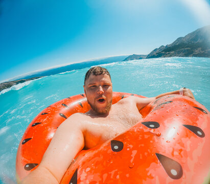 Man relaxing on ring in Adriatic sea