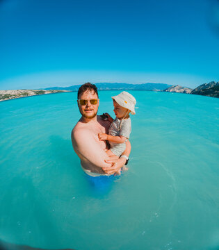 Family swimming together in Adriatic sea