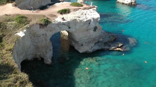 Puglia, Italy, Drone Footage of Torre Sant'Andrea Natural Rock Formations and Turquoise Sea, Ocean, Beach