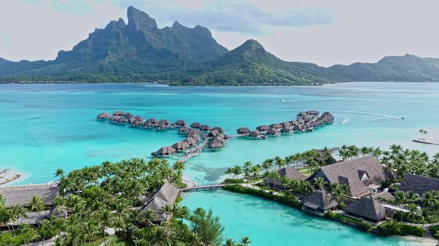 Bora Bora Island, French Polynesia. Drone Shot of Luxury Resort Overwater Villas, Turquoise Lagoons and Main Island