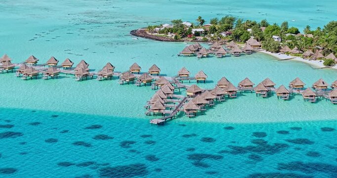 Drone Shot of Bora Bora Island Luxury Resort, French Polynesia, Bungalows Over Turquoise Water and White Sand Beach