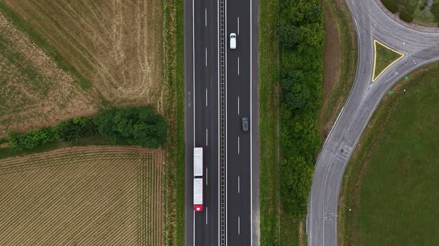 Birdseye Aerial View of European Highway Traffic, Moving Cars and Trucks, Top Down Drone Shot