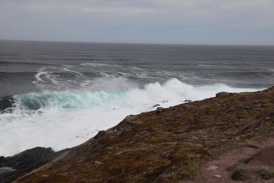 Waves crashing against the rugged rocky coastline of Blackhead, Newfoundland