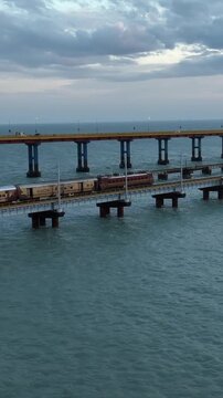 Vertical Aerial Night View of Train Crossing Pamban Bridge Tamil Nadu India