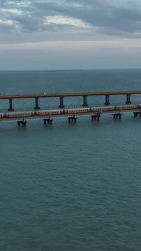 Vertical Aerial Night View of Train Crossing Pamban Bridge Tamil Nadu India