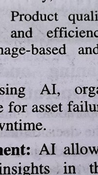 AI (artificial intelligence) word printed on news articles, books or magazine white page background. AI technology growth, hype, boom or concern concept. Closeup of emphasize and highlight AI text.