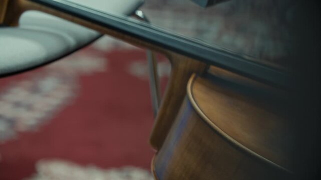Close up of a beautiful violin resting against a chair, classical music, 4k
