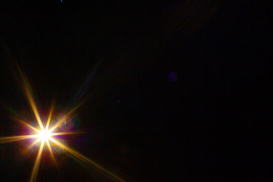 Sun flare on the black background