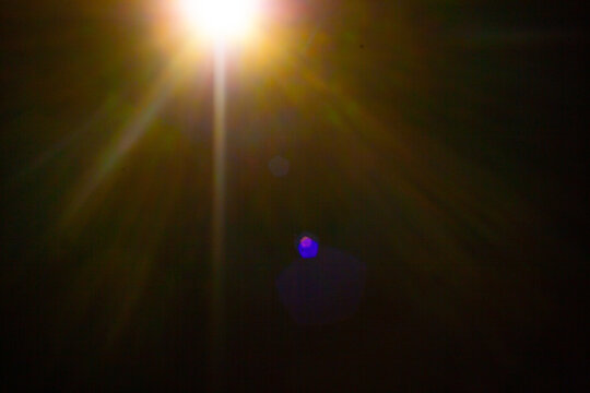 Sun flare on the black background