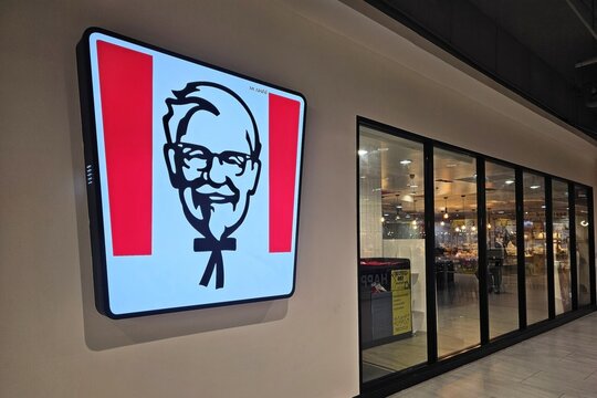 Bangkok, Thailand - July 22, 2026: KFC restaurant storefront sign with the Colonel Sanders logo at a shopping mall in Thailand.