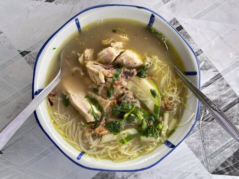 Warm chicken vermicelli soup served with tender chicken and fresh herbs in a comforting homemade bowl.