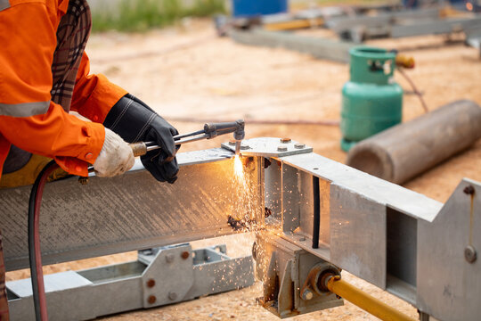 Gas cutting equipment with cylinder and hoses used for metal fabrication