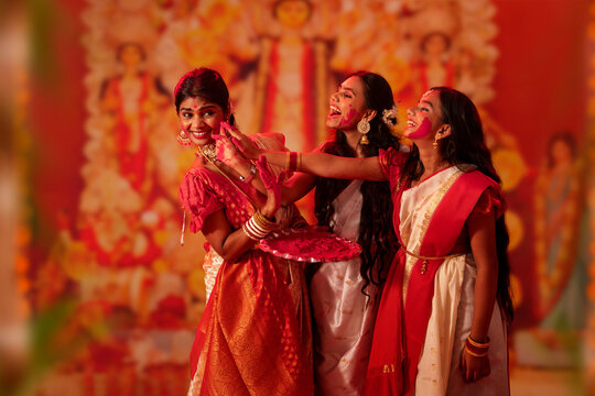 Bengali women celebrating Durga Puja