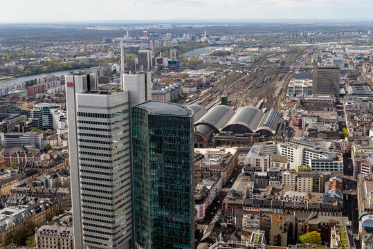 FRANKFURT, GERMANY - APRIL 4, 2026: An aerial view focusing on the Frankfurt Hauptbahnhof central train station and the nearby Silberturm skyscraper