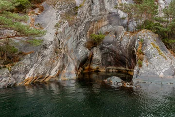 Natural Granite Cave on the Shores of Lysefjord, Norway © Olga