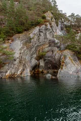 Natural Granite Cave on the Shores of Lysefjord, Norway © Olga