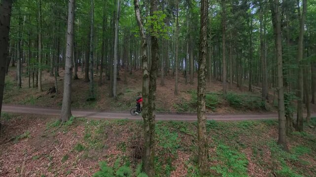 High Speed Side Profile Aerial Cyclist Descending Forest Trail Czech Drone
