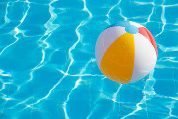 Colorful inflatable ball floating in swimming pool © nata777_7