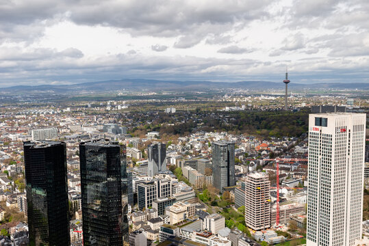 FRANKFURT, GERMANY - APRIL 4, 2026: An aerial panoramic view of the Opernturm skyscraper and Deutsche Bank Twin Towers with the Europaturm telecommunication tower in the distance