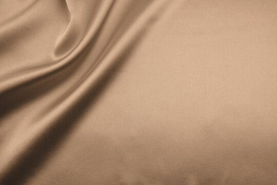 brown satin or silk fabric as background