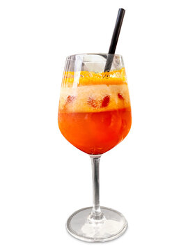Refreshing non alcoholic orange fruit cocktail with ice cubes and foam served in elegant stemmed glass isolated, with a straw, healthy summer beverage concept.