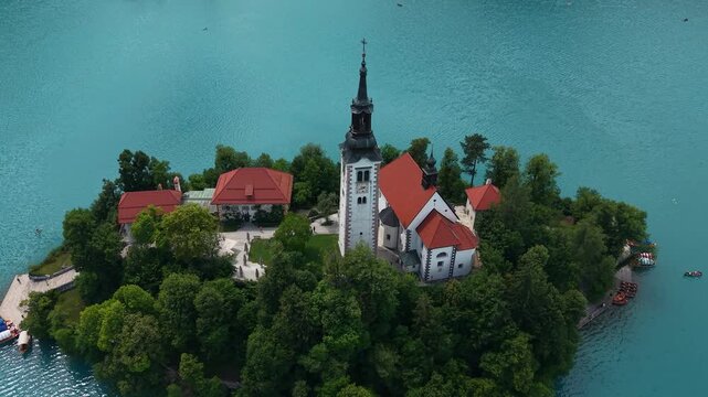 Drone Shot of Church Tower on Small Island in Lake Bled, Slovenia, Tourist Attraction and Landmark