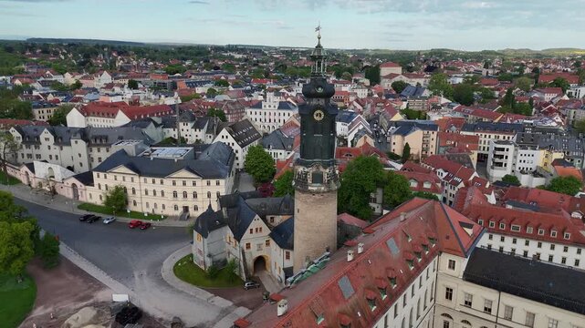 Drone passes close to tower then curves toward nearby monument building