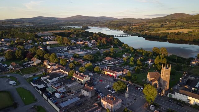 Blessington main street during golden hour with lakeside setting, County Wicklow, Ireland aerial