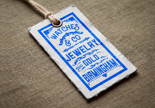 Recycled paper tag mockup with string on textile
