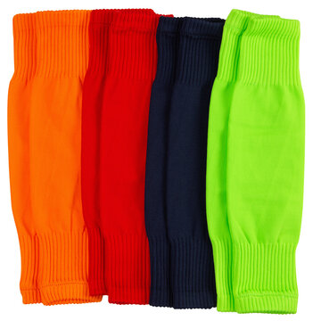 Set of colorful football leg sleeves isolated on white background. Multi-colored soccer calf compression sleeves for shin guard protection