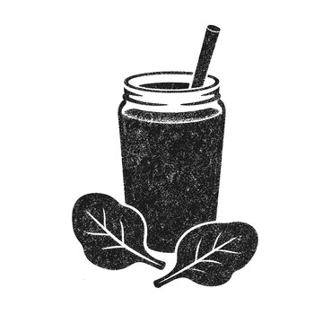 Green smoothie with spinach in glass jar with straw and leaves  