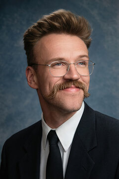 people of ai, yearbook photography of a man with high brown pompadour, pleasant neutral expression, wearing black suit with a white shirt and black tie, 1990s portrait cyan, photorealistic AJS