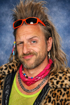 people of ai, yearbook photography of a man with wild gray-blond mullet, smug half-smile, wearing leopard-print jacket, 1980s portrait blue, photorealistic DOC