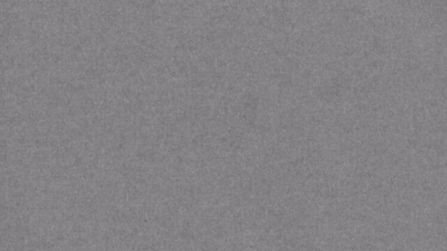 Abstract smooth gray surface with subtle grain texture background.